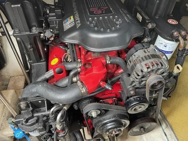 Slide: The Image of Engine of a 2008 Larson Cabrio 330 Day Cruiser, showcasing detailed components. - 14