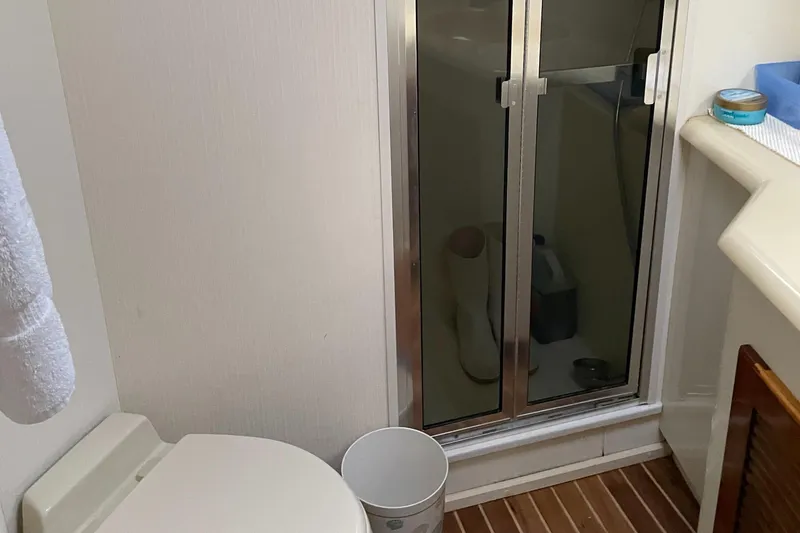 Slide: The Image of Bathroom interior of 1996 Viking 47 Convertible yacht with shower and toilet. - 14