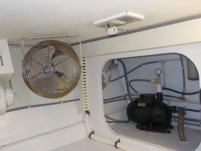 Slide: The Image of Engine room of 1996 Viking 47 Convertible yacht with fan and plumbing. - 30