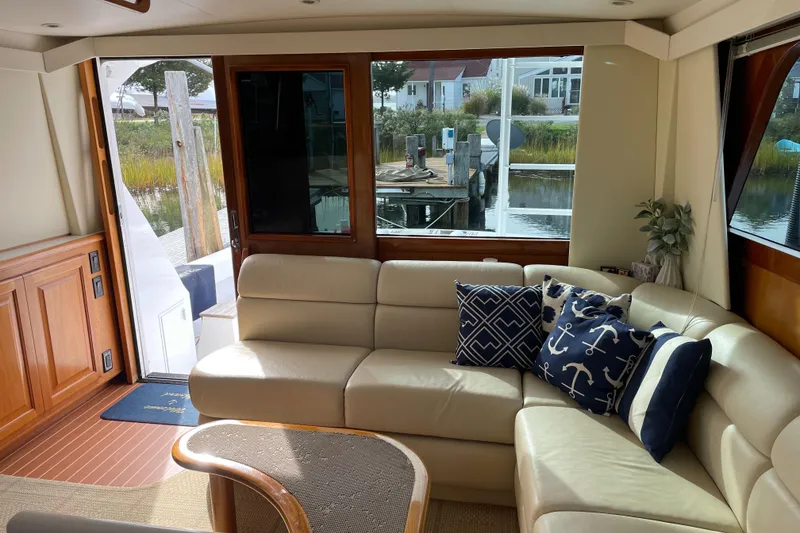 Slide: The Image of Luxurious interior of 1996 Viking 47 Convertible yacht with elegant seating and nautical decor. - 4