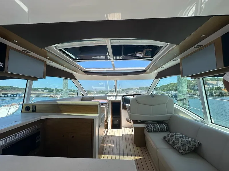 Slide: The Image of Interior of 2015 Cruisers Yachts 45 Cantius with panoramic windows and modern seating. - 13