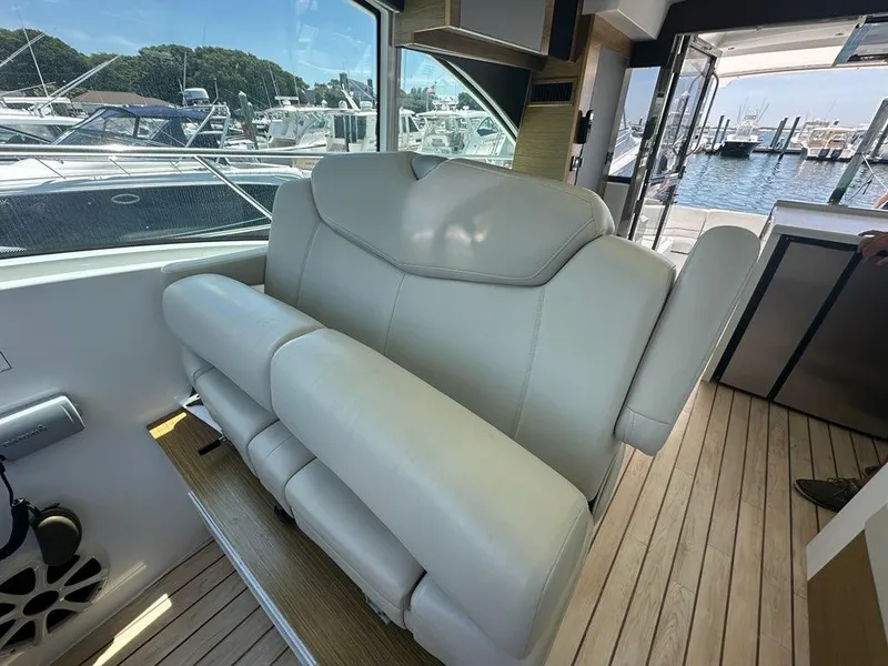 Slide: The Image of Luxurious interior seating on a 2015 Cruisers Yachts 45 Cantius, docked at a marina. - 20