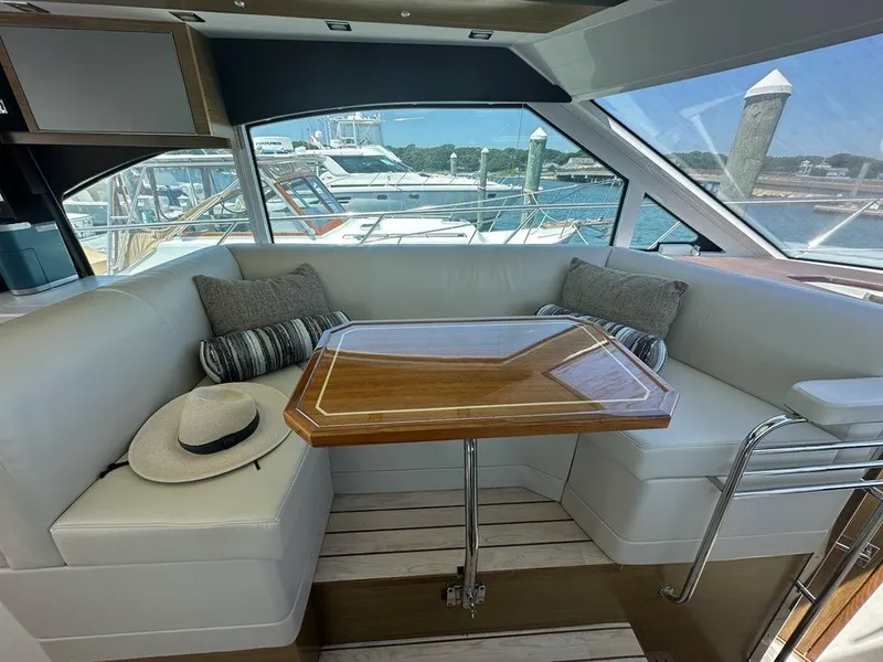 Slide: The Image of Interior of 2015 Cruisers Yachts 45 Cantius with elegant seating and table. - 21