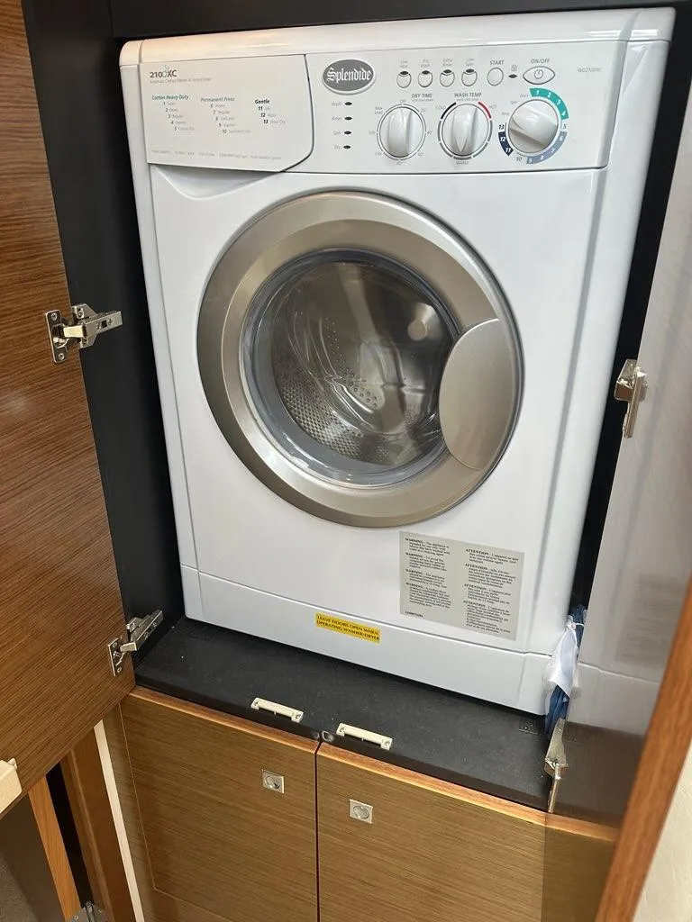 Slide: The Image of Splendide washer in 2015 Cruisers Yachts 45 Cantius, installed in wooden cabinet. - 35