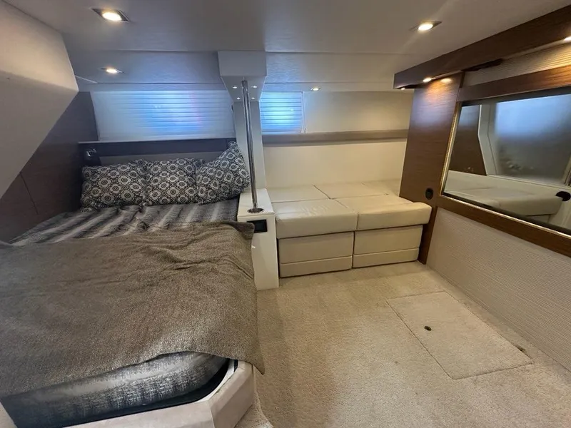 Slide: The Image of Interior of 2015 Cruisers Yachts 45 Cantius with cozy bed and seating area. - 46