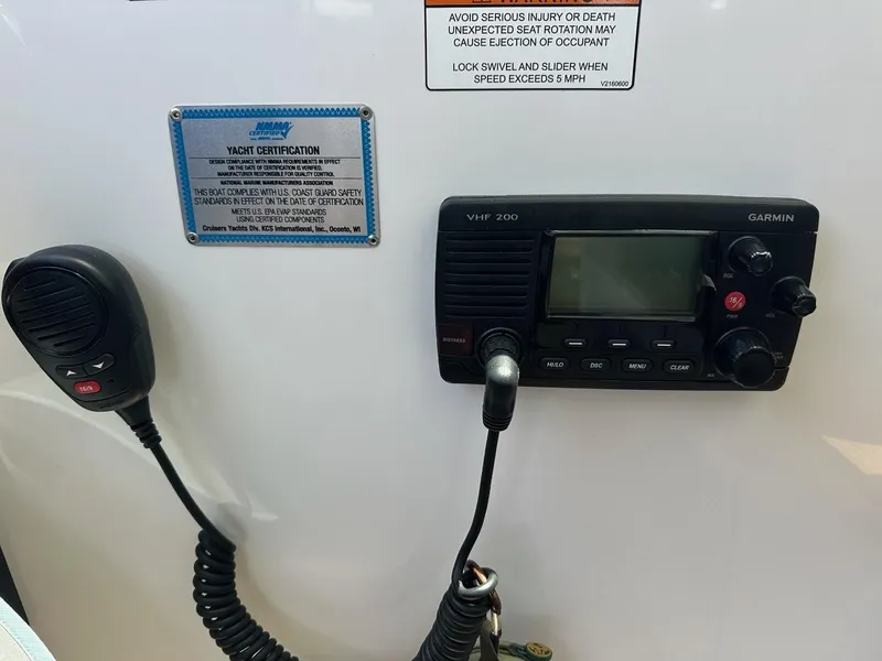 Slide: The Image of VHF radio and certification plaque on 2015 Cruisers Yachts 45 Cantius. - 18