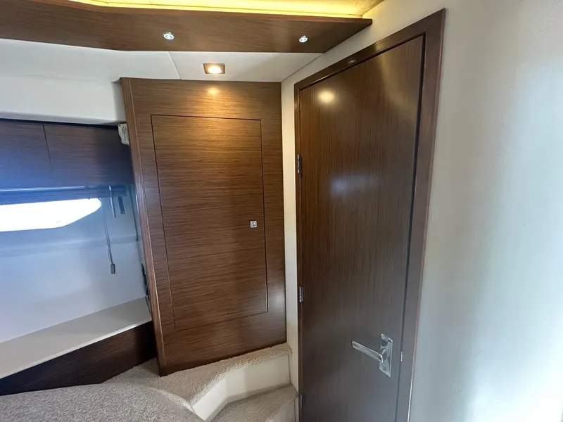 Slide: The Image of Interior of 2015 Cruisers Yachts 45 Cantius with wooden door and modern lighting. - 40