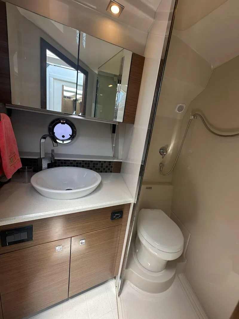 Slide: The Image of Luxurious bathroom in 2015 Cruisers Yachts 45 Cantius with modern fixtures and elegant design. - 42