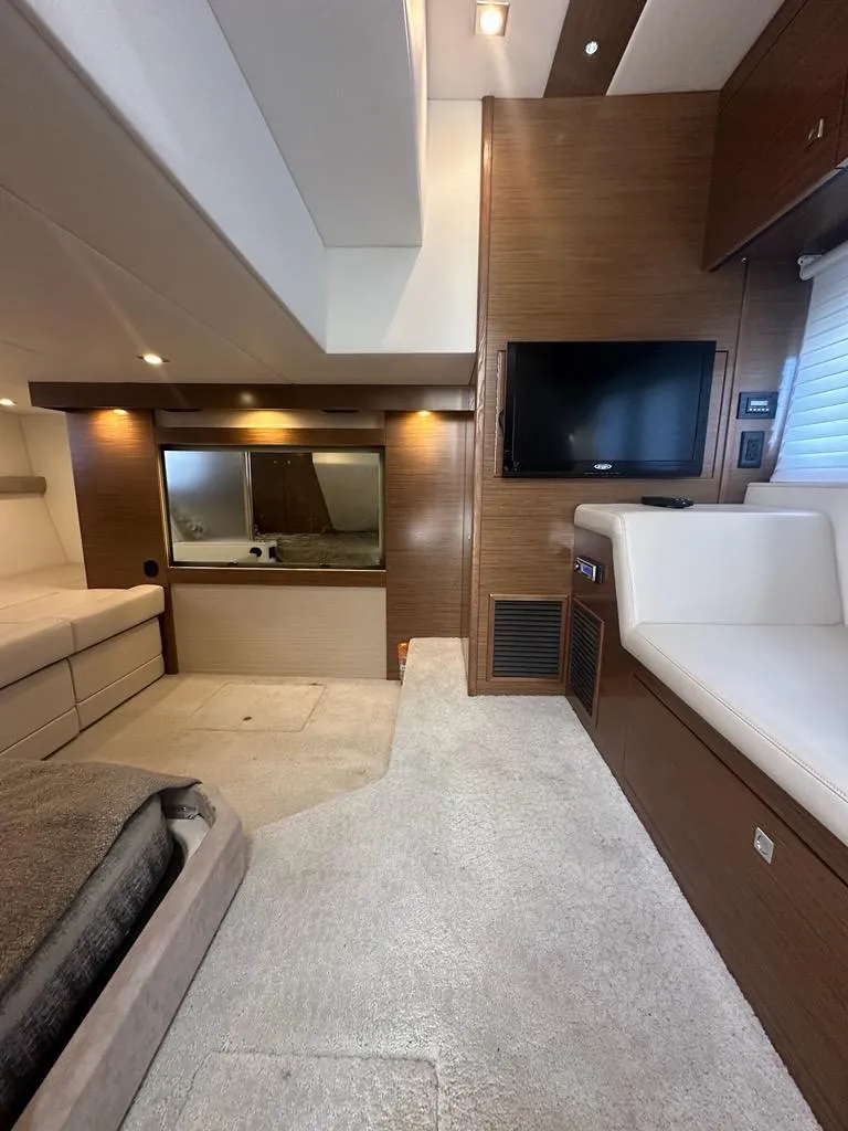 Slide: The Image of Luxurious interior of 2015 Cruisers Yachts 45 Cantius with modern furnishings and TV. - 44