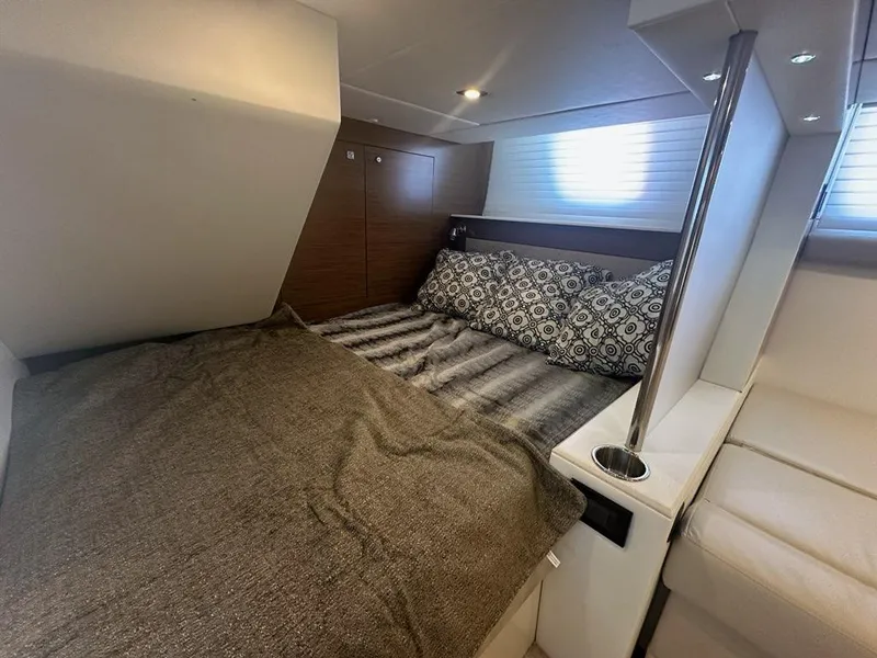 Slide: The Image of Luxurious cabin interior of 2015 Cruisers Yachts 45 Cantius with cozy bedding. - 48