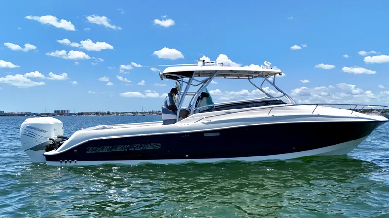 The Image of 2006 Hydra-Sports Vector VX boat on water under clear blue sky. - 1