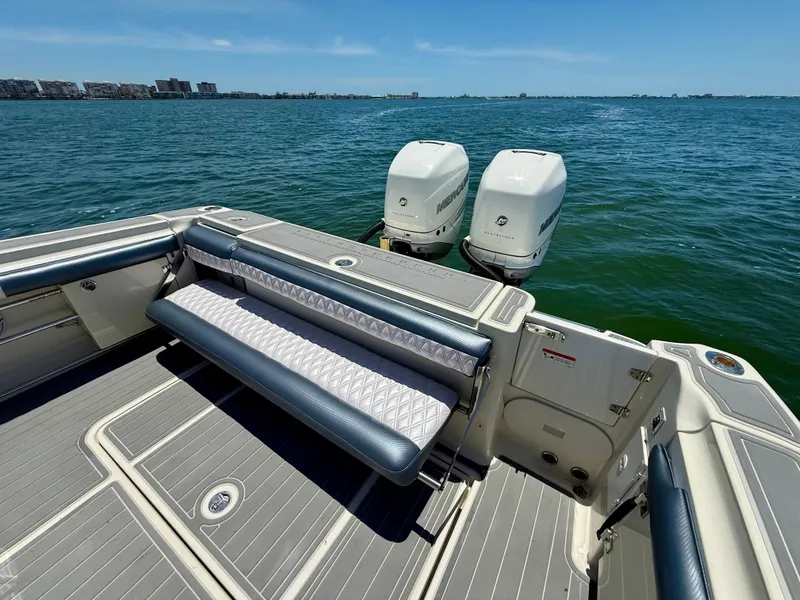 Slide: The Image of 2006 Hydra-Sports Vector VX boat with dual Mercury engines on open water. - 11