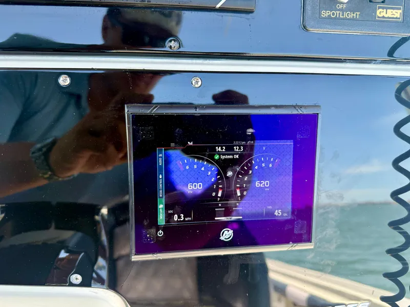 Slide: The Image of 2006 Hydra-Sports Vector VX dashboard with digital display showing engine RPM and system status. - 18