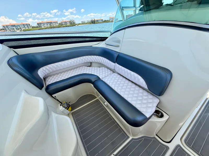 Slide: The Image of 2006 Hydra-Sports Vector VX boat interior with cushioned seating and scenic waterfront view. - 20