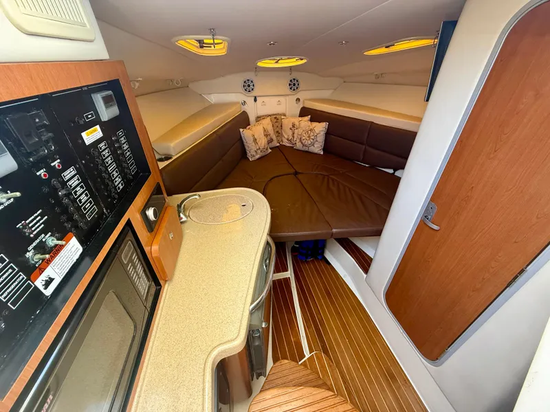 Slide: The Image of 2006 Hydra-Sports Vector VX cabin interior with kitchenette and seating area. - 22