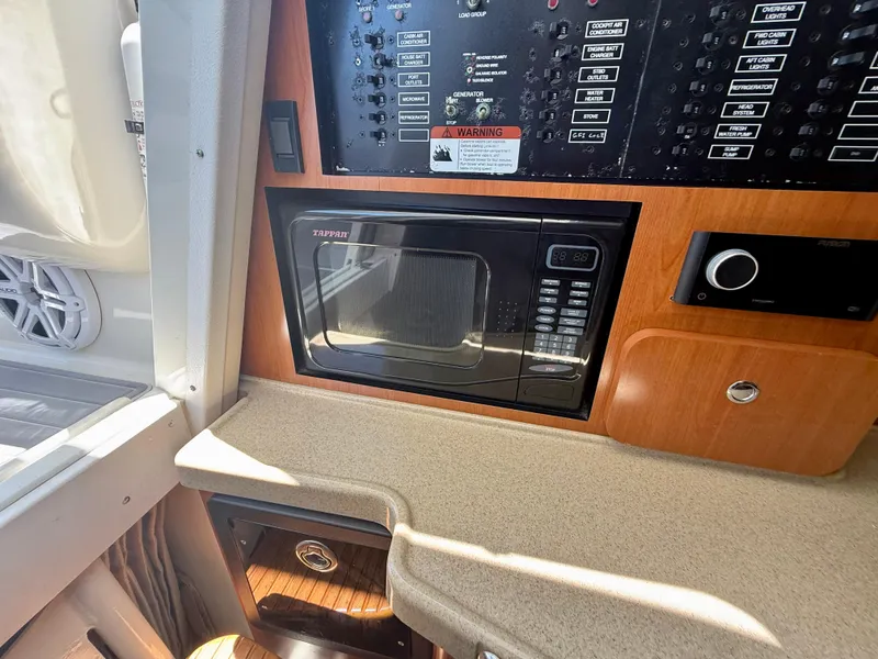 Slide: The Image of 2006 Hydra-Sports Vector VX interior with control panel and Tappan microwave. - 24