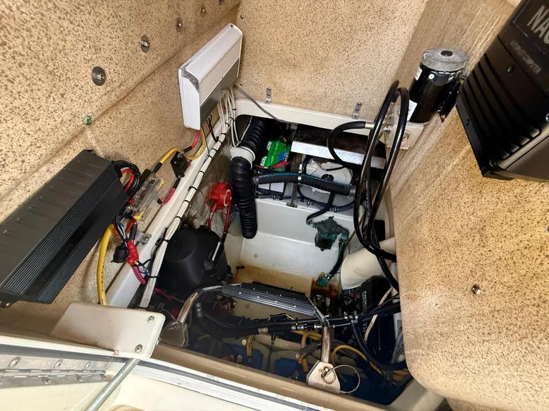 Slide: The Image of Engine compartment of a 2006 Hydra-Sports Vector VX boat, showcasing wiring and components. - 30