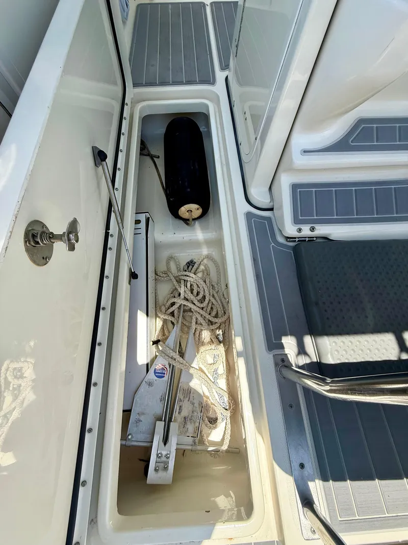 Slide: The Image of 2006 Hydra-Sports Vector VX boat storage compartment with anchor and rope. - 31