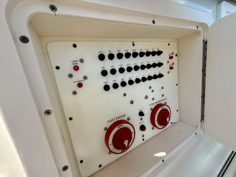 Slide: The Image of Control panel of a 2006 Hydra-Sports Vector VX boat, featuring switches and dials. - 32