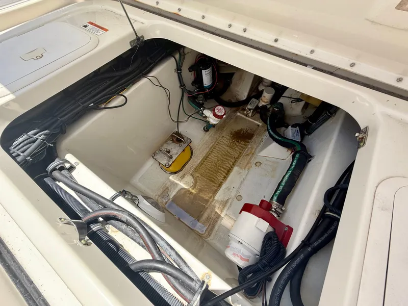 Slide: The Image of 2006 Hydra-Sports Vector VX engine compartment with wiring and components. - 33