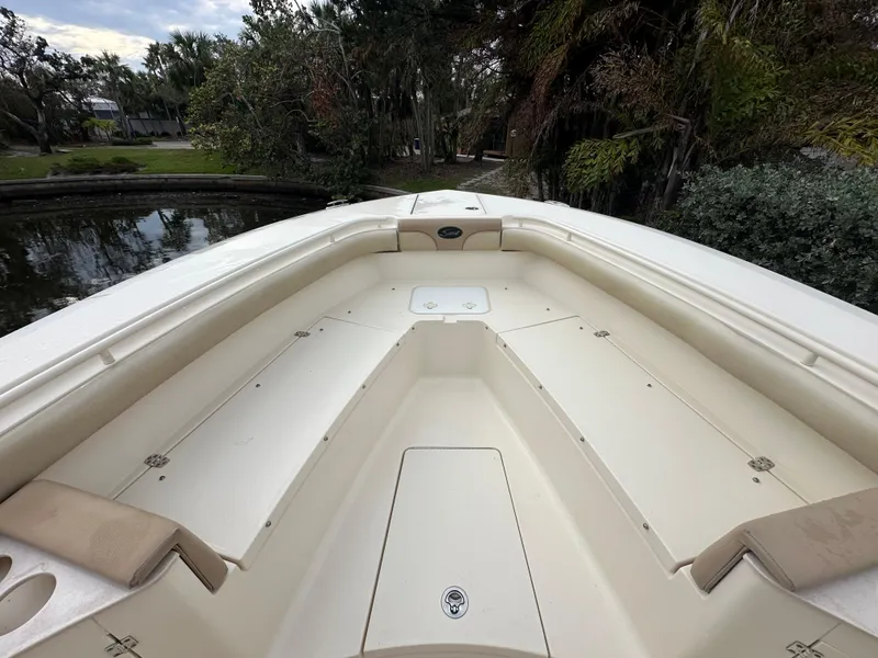 Slide: The Image of 2012 Scout 275 XSF boat interior with spacious seating and storage. - 10