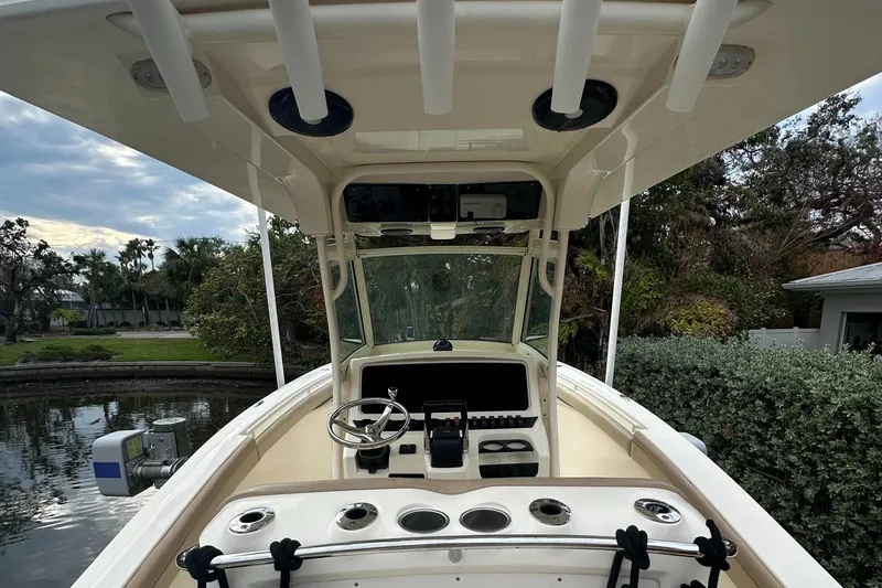 Slide: The Image of 2012 Scout 275 XSF boat interior with steering wheel and control panel. - 3