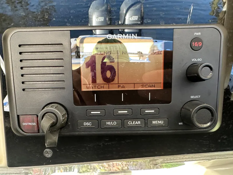 Slide: The Image of Garmin marine radio on 2012 Scout 275 XSF boat dashboard, displaying channel 16. - 5