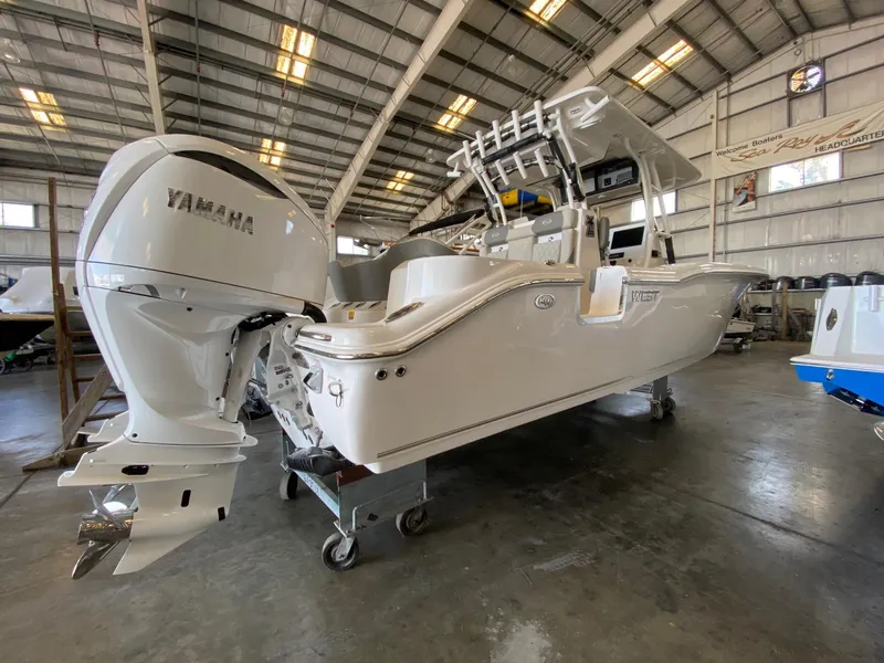 The Image of 2026 Key West 291 FS boat with Yamaha engine in a warehouse setting. - 0