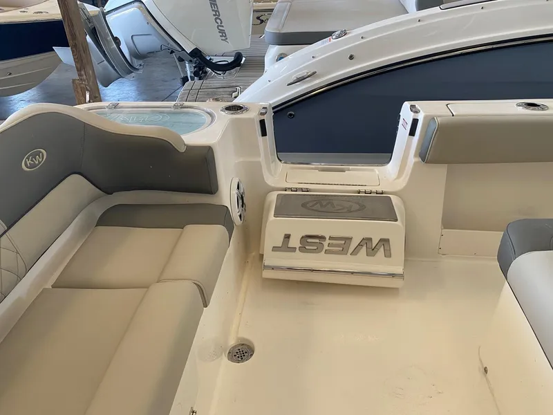 Slide: The Image of Interior view of a 2026 Key West 291 FS boat with cushioned seating. - 15