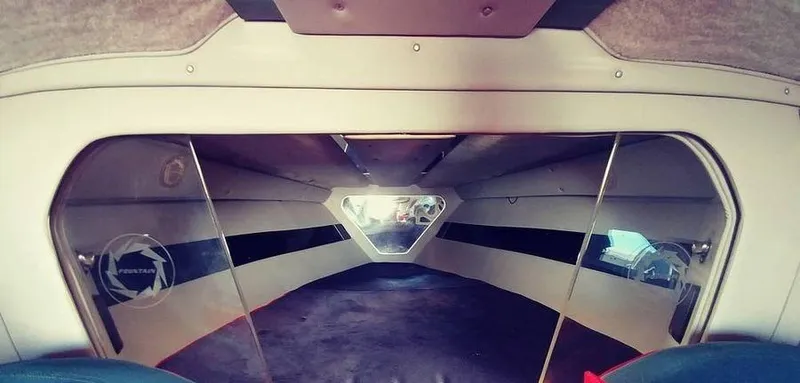 Slide: The Image of Interior of a 1988 Fountain 12 Meter boat, featuring sleek design and spacious cabin. - 20