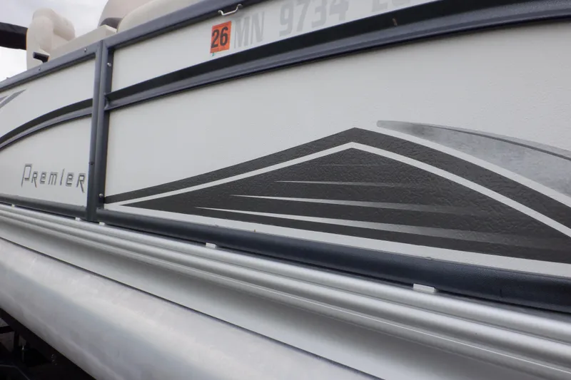 Slide: The Image of 2019 Premier 220 SunSation pontoon boat with sleek side graphics and registration number. - 10