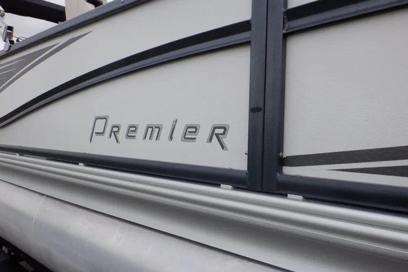 Slide: The Image of 2019 Premier 220 SunSation pontoon boat side view with logo detail. - 11