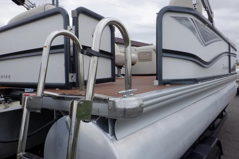 Slide: The Image of 2019 Premier 220 SunSation pontoon boat with stainless steel ladder and sleek design. - 13
