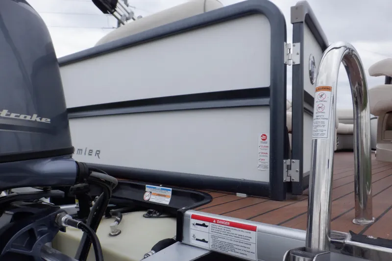 Slide: The Image of 2019 Premier 220 SunSation boat with outboard motor and safety warnings. - 14