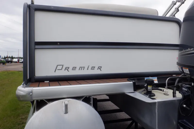 Slide: The Image of 2019 Premier 220 SunSation pontoon boat rear view with motor and deck details. - 16