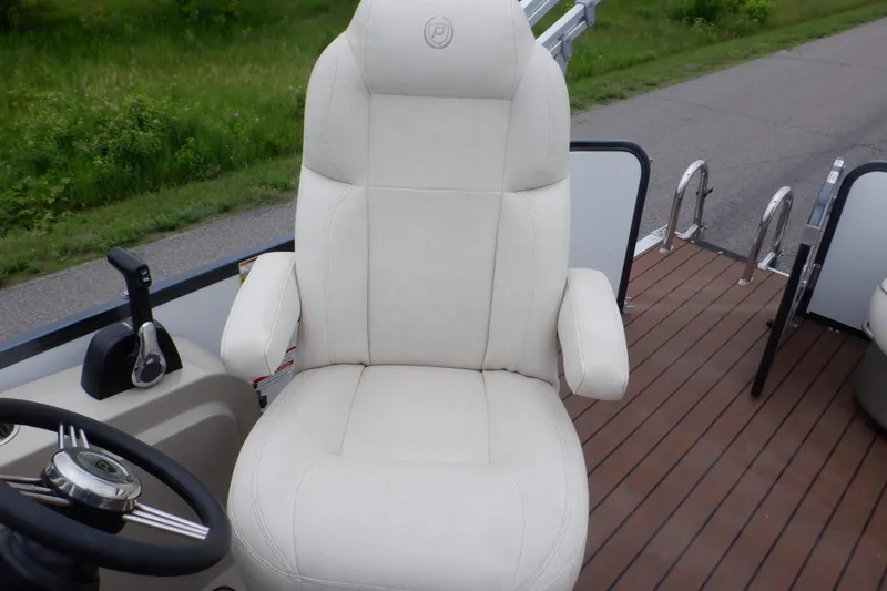 Slide: The Image of Captain's chair on 2019 Premier 220 SunSation boat with wooden deck background. - 30