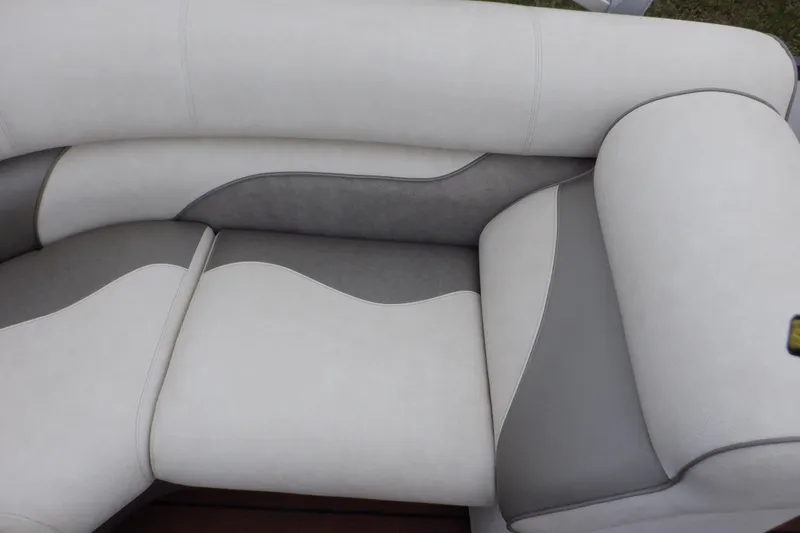 Slide: The Image of 2019 Premier 220 SunSation boat seating with gray and white upholstery. - 38