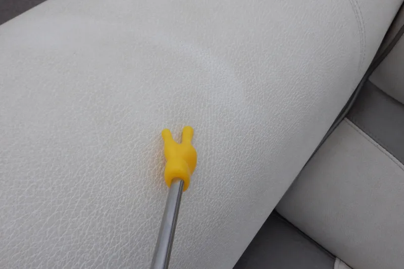 Slide: The Image of Yellow tool on white leather seat of 2019 Premier 220 SunSation boat. - 44