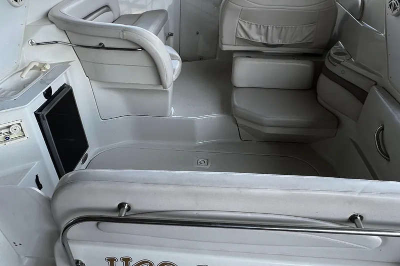 Slide: The Image of 1998 Regal Commodore 2760 boat interior with seating and storage areas. - 12