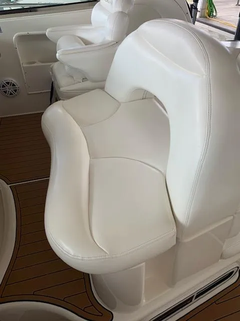Slide: The Image of White leather seating on 2001 Sea Ray 380 Sundancer boat interior. - 25