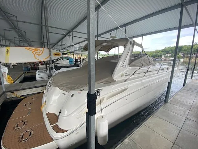 Slide: The Image of 2001 Sea Ray 380 Sundancer docked under a covered marina. - 4