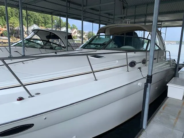 Slide: The Image of 2001 Sea Ray 380 Sundancer docked in a covered marina. - 5