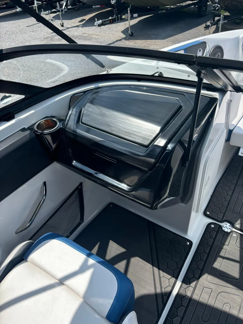 Slide: The Image of 2025 Scarab 195 H.O. boat interior with sleek dashboard and seating. - 5