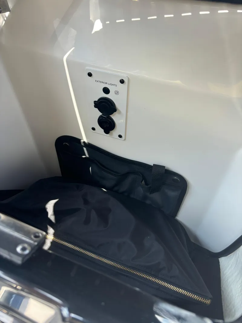 Slide: The Image of Control panel and storage area in 2025 Scarab 195 H.O. boat. - 6