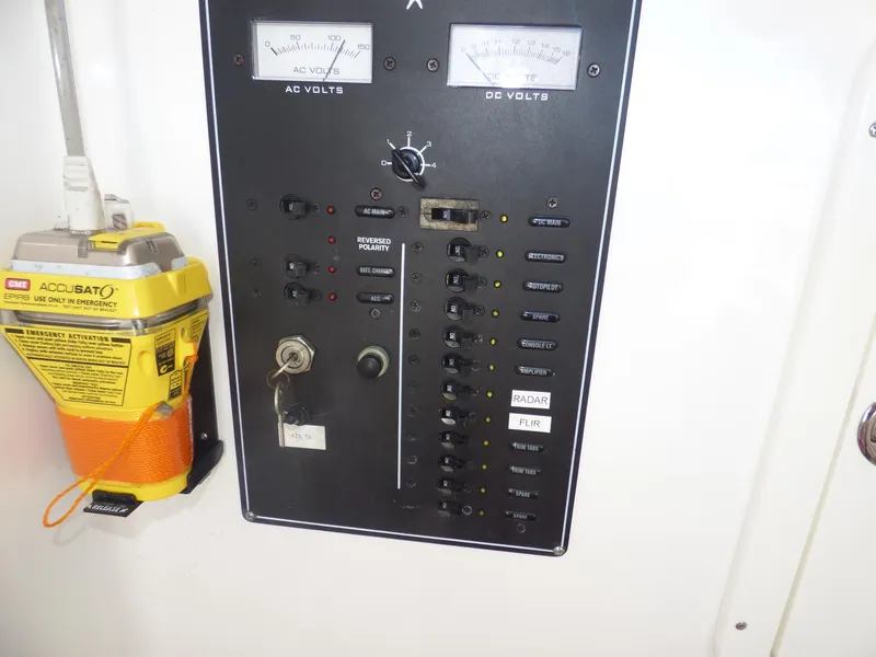 Slide: The Image of Electrical panel with voltmeters and switches on a 2011 Invincible 36 CC boat. - 11