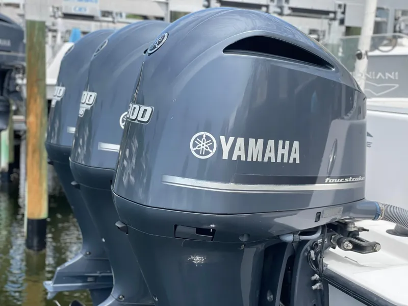Slide: The Image of Yamaha four-stroke outboard engines on a 2011 Invincible 36 CC boat. - 3
