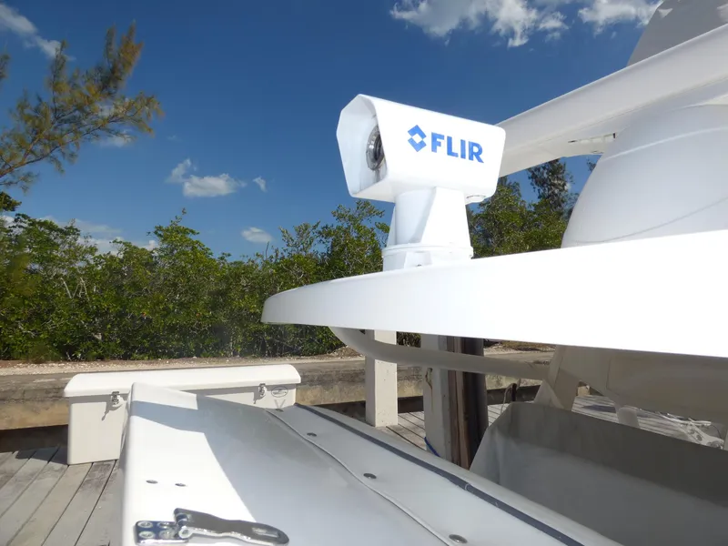 Slide: The Image of FLIR camera on 2011 Invincible 36 CC boat under clear blue sky. - 4