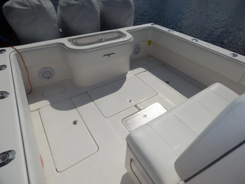 Slide: The Image of Invincible 36 CC 2011 boat deck with seating and storage compartments. - 5