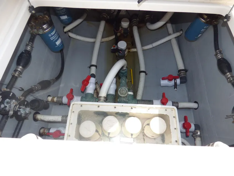 Slide: The Image of Engine compartment of a 2011 Invincible 36 CC boat, showing hoses and valves. - 7