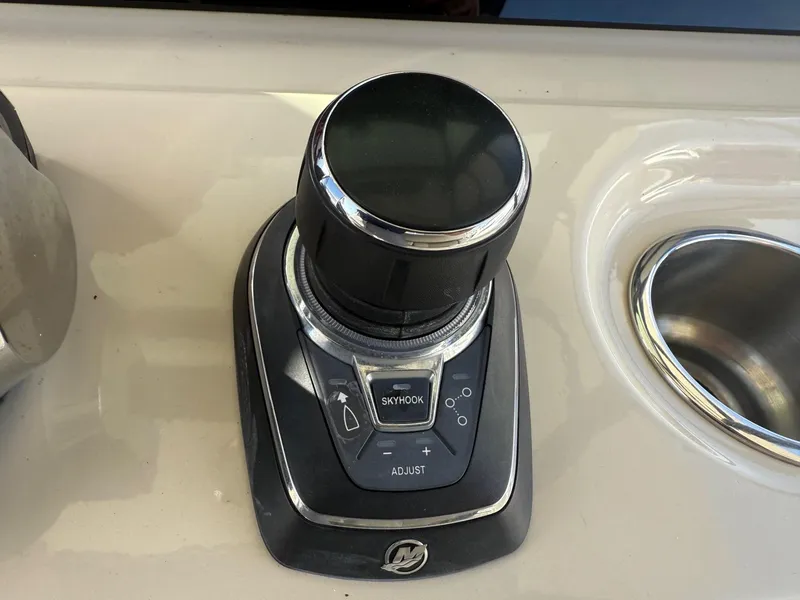 Slide: The Image of Joystick control on 2021 Boston Whaler 330 Outrage boat dashboard. - 20